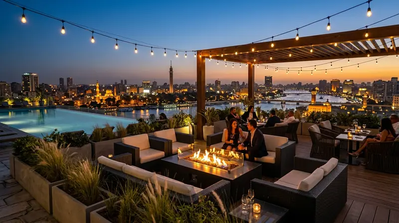 Rooftop lounge at blue hour with fire tables, string lights and a pool overlooking the Nile and the city